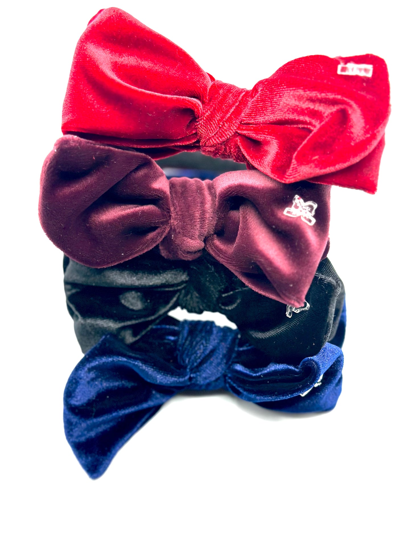 Hard headband with suede bow.